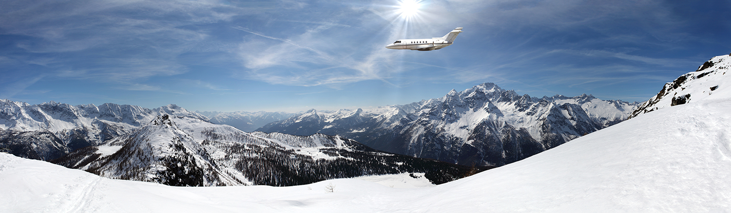Plane flying over a snow capped mountain Plane flying over a snow capped mountain