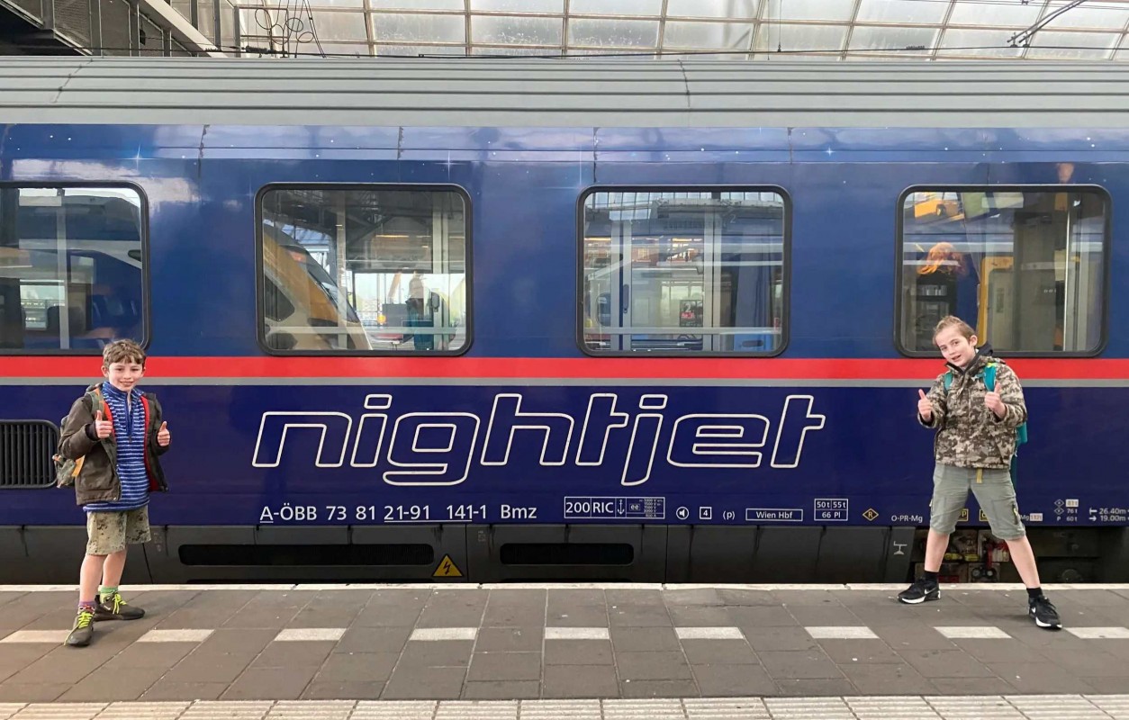 Children ready to board the NightJet train to Austria
