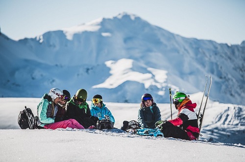 Group of skiers resting in the Austrian alps 