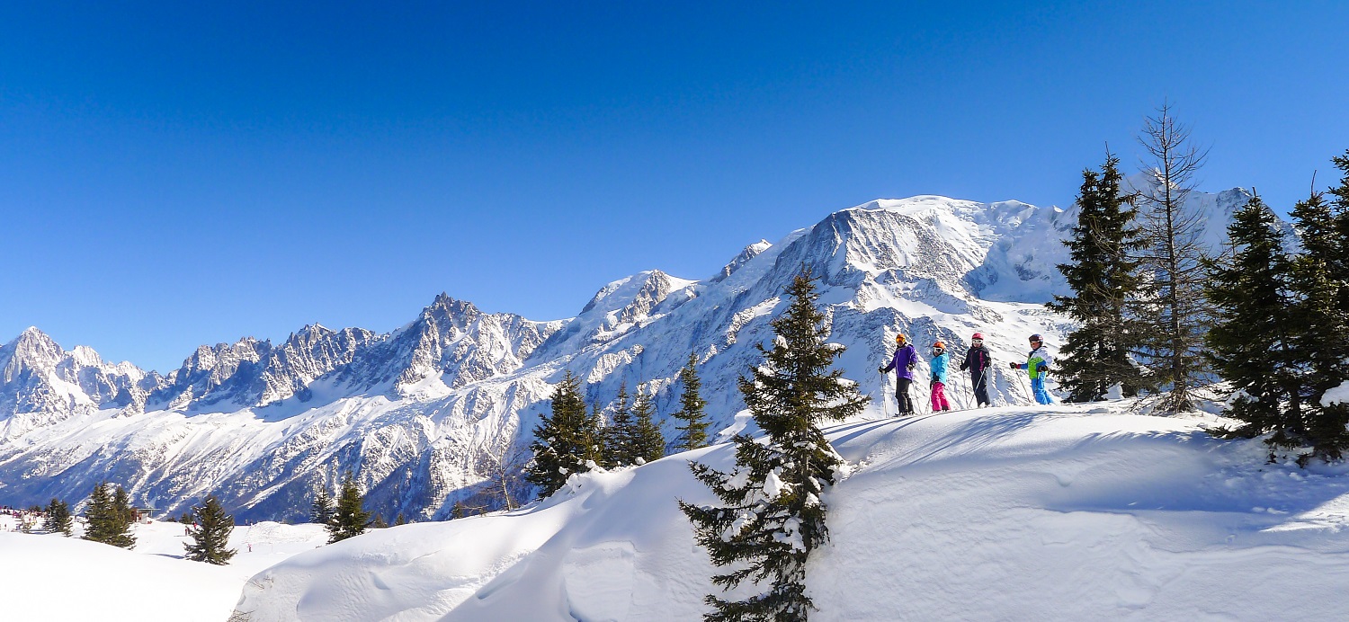 Young skiers with Mont Blanc behind