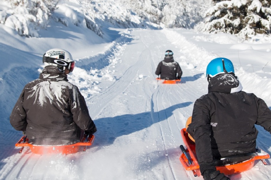 Brides Les Bains family fun ski trips Sledging down the slopes in Brides Les Bains`