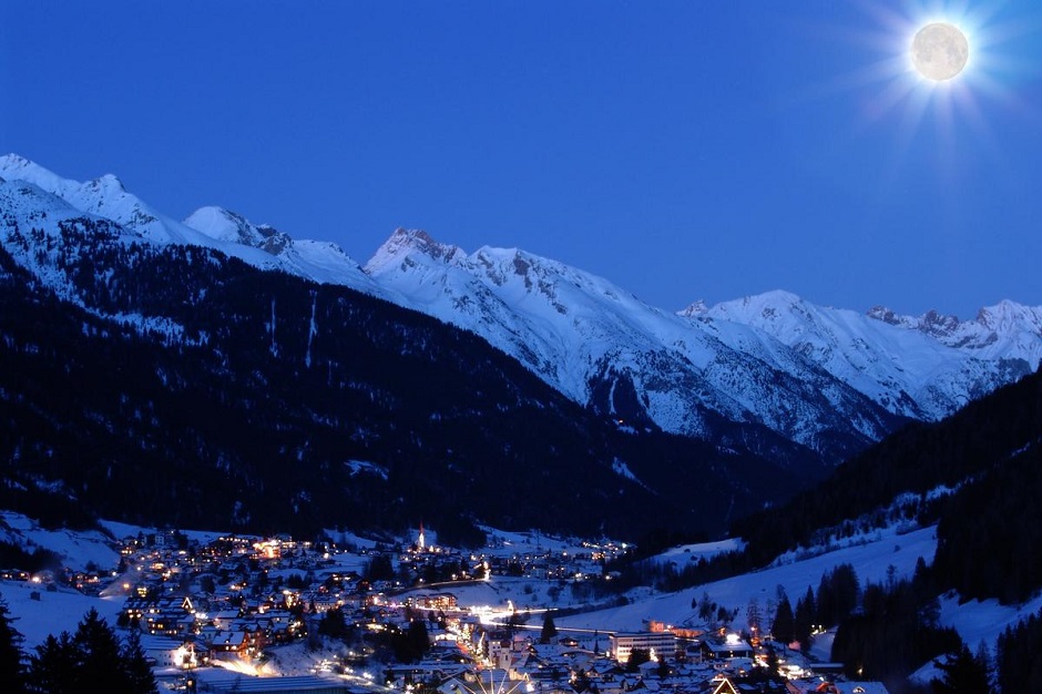 St Anton surrounded by snowy mountains in the night