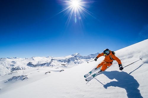 Skier with pure blue sky